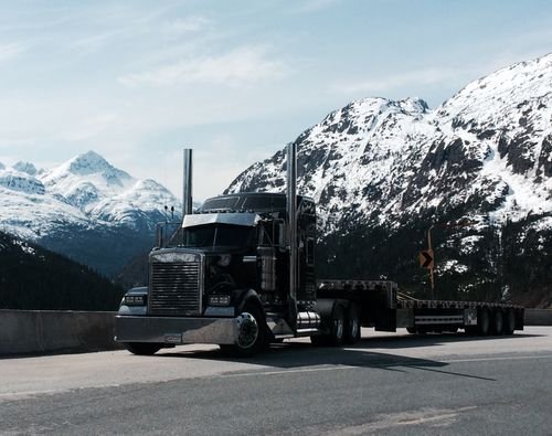 Free Happy multiethnic friends with burgers taking selfie near food truck Stock Photo